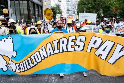 NYC protesters hold a banner calling for a billionaires tax last month.